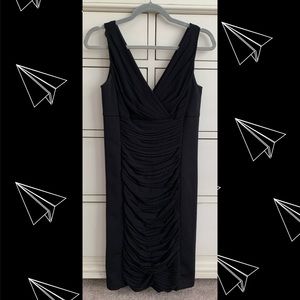 Black form fitting sleeveless dress